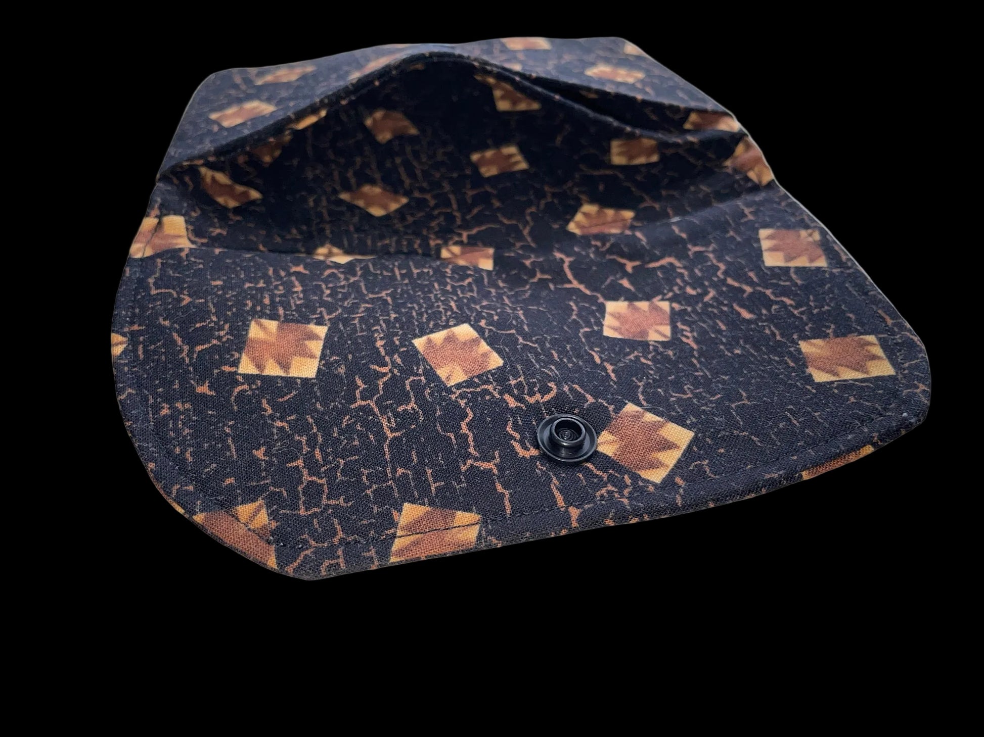 Small pouch with a patterned design on a surface