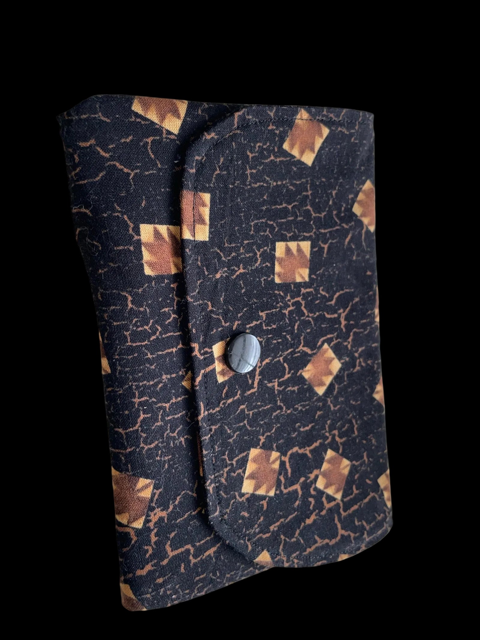 Folded fabric with geometric pattern on a white background