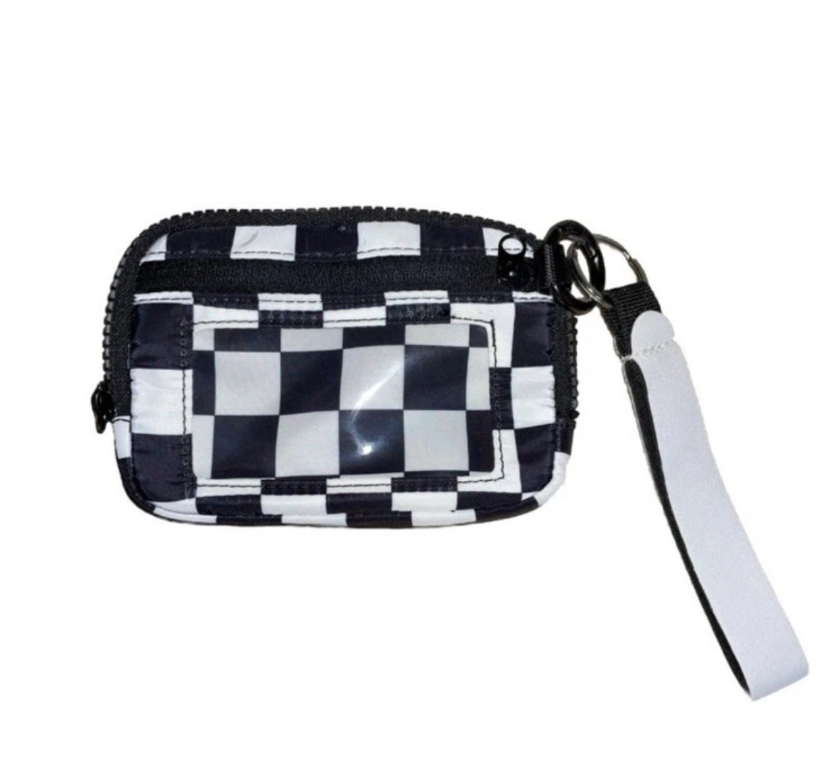 Checker is wallet with white wrist strap