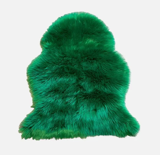 Green faux fur rug on a white background