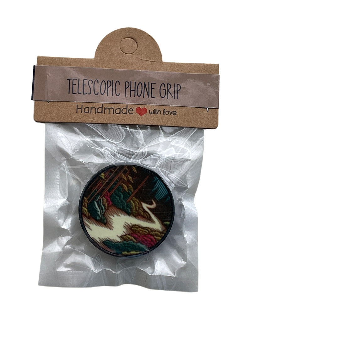 Telescopic phone grip in packaging with a cardboard label on a white background