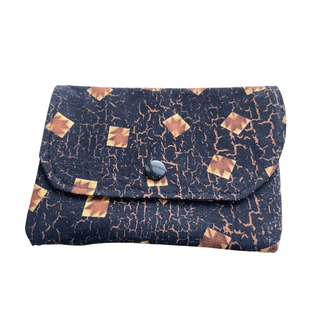 Small wallet with a patterned design on a white background