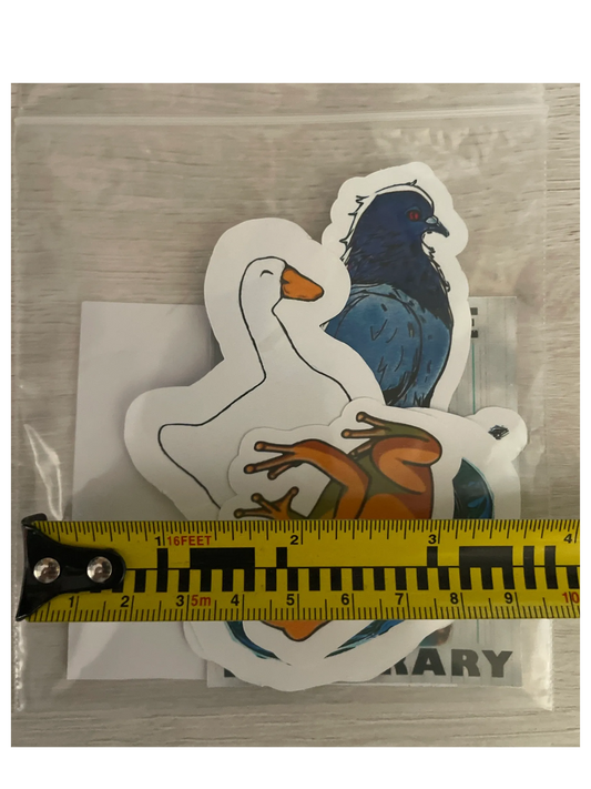 Three animal-shaped stickers (goose, bird, frog) on a clear background with a ruler for scale.
